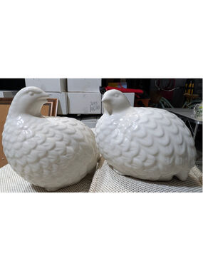 Vintage white ceramic quail figurines featuring a glossy glazed